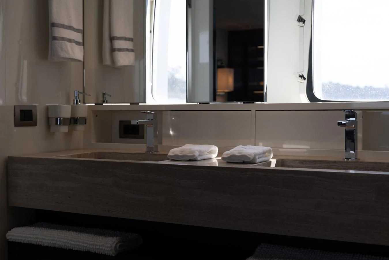 a bathroom with a countertop sink and towels aboard ELLIE JAMES Yacht for Sale