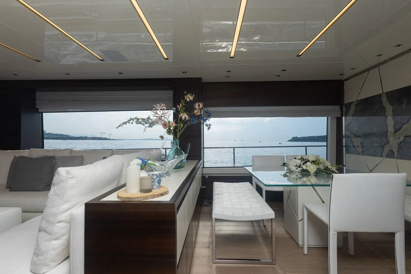 a room with a table chairs and a window aboard ELLIE JAMES Yacht for Sale