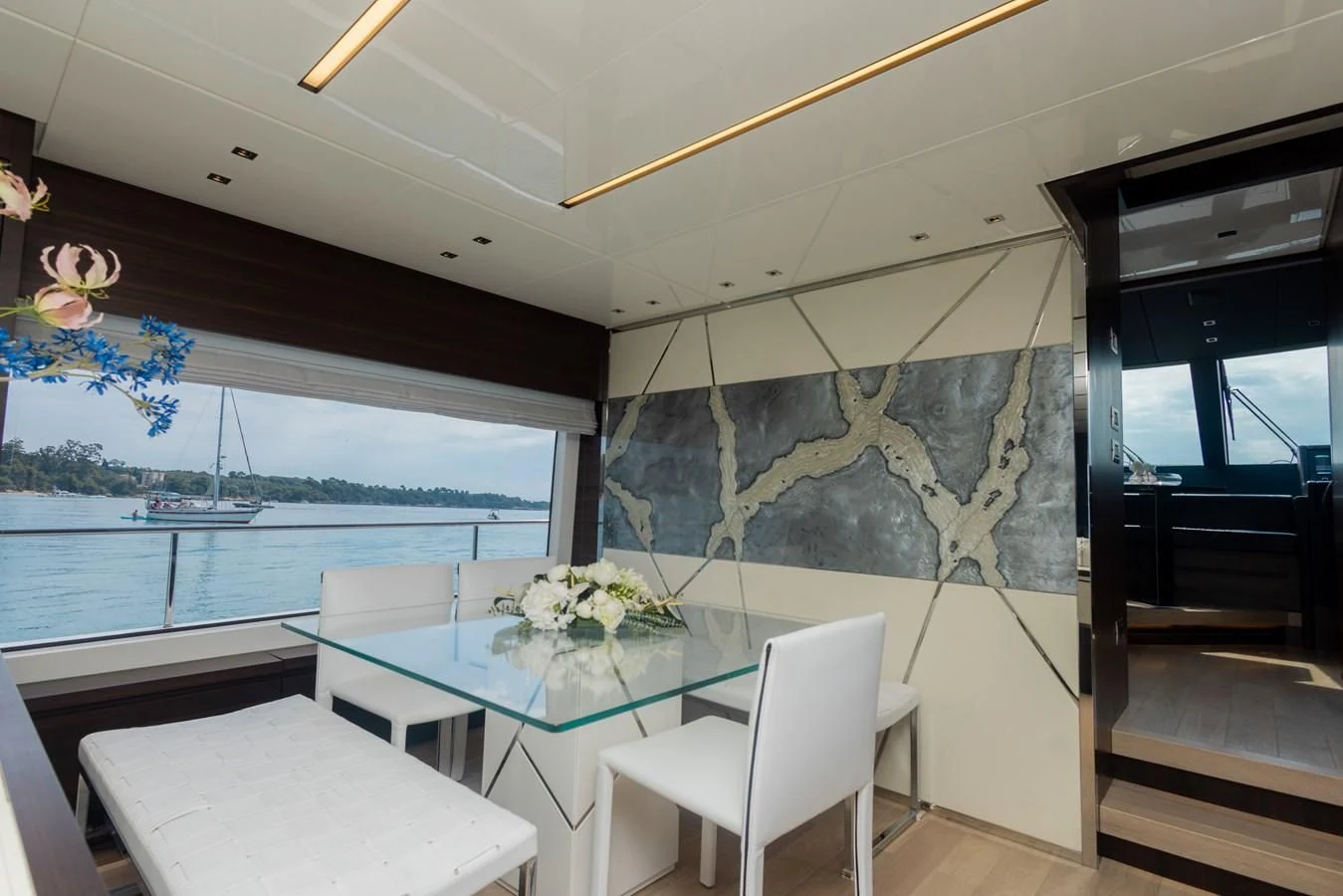 a room with a table and chairs aboard ELLIE JAMES Yacht for Sale