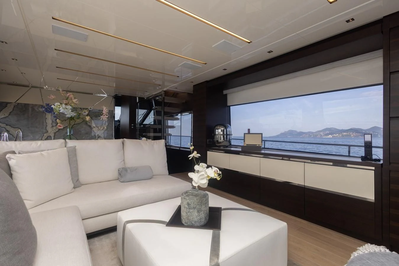a living room with a large window aboard ELLIE JAMES Yacht for Sale