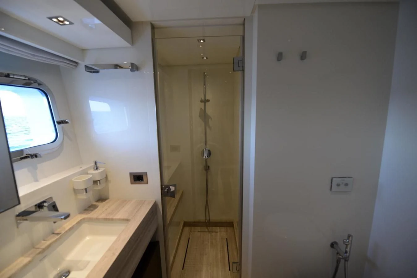 a bathroom with a sink and a window aboard ELLIE JAMES Yacht for Sale