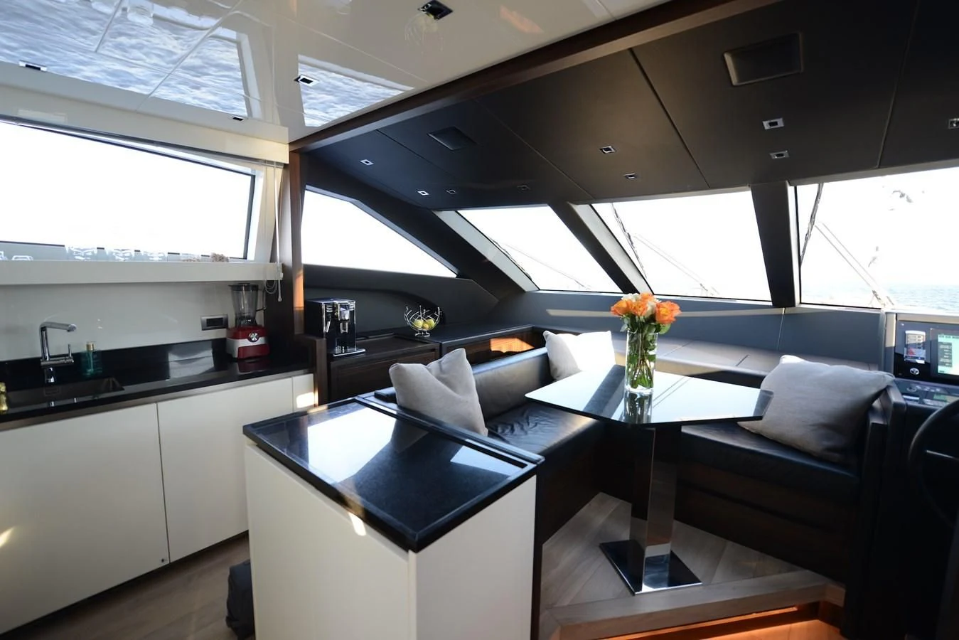a kitchen with a black table aboard ELLIE JAMES Yacht for Sale