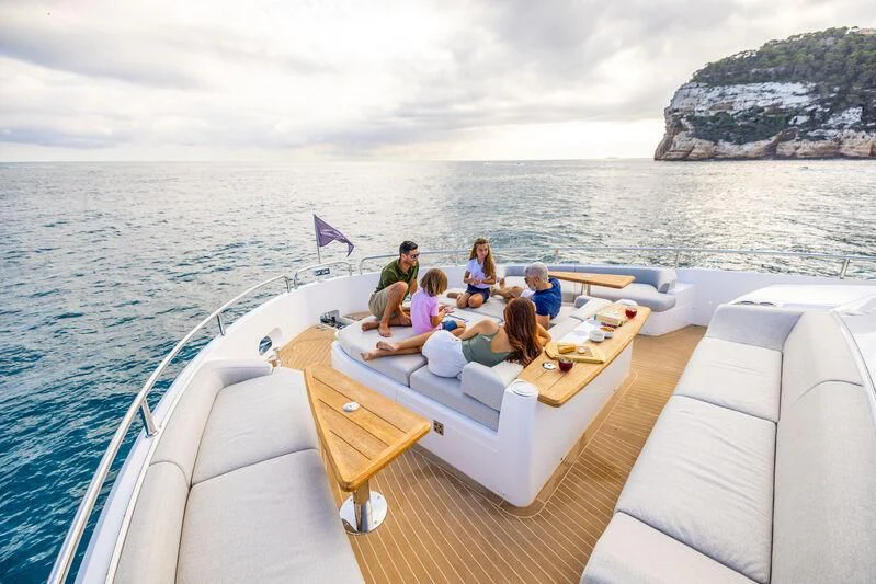 a group of people sitting on a boat in the water aboard BANDAZUL Yacht for Sale