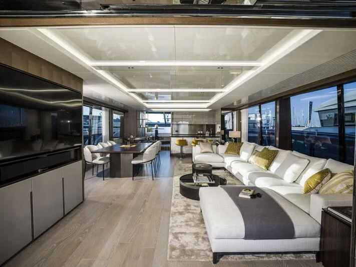 a room with couches and a table aboard BANDAZUL Yacht for Sale