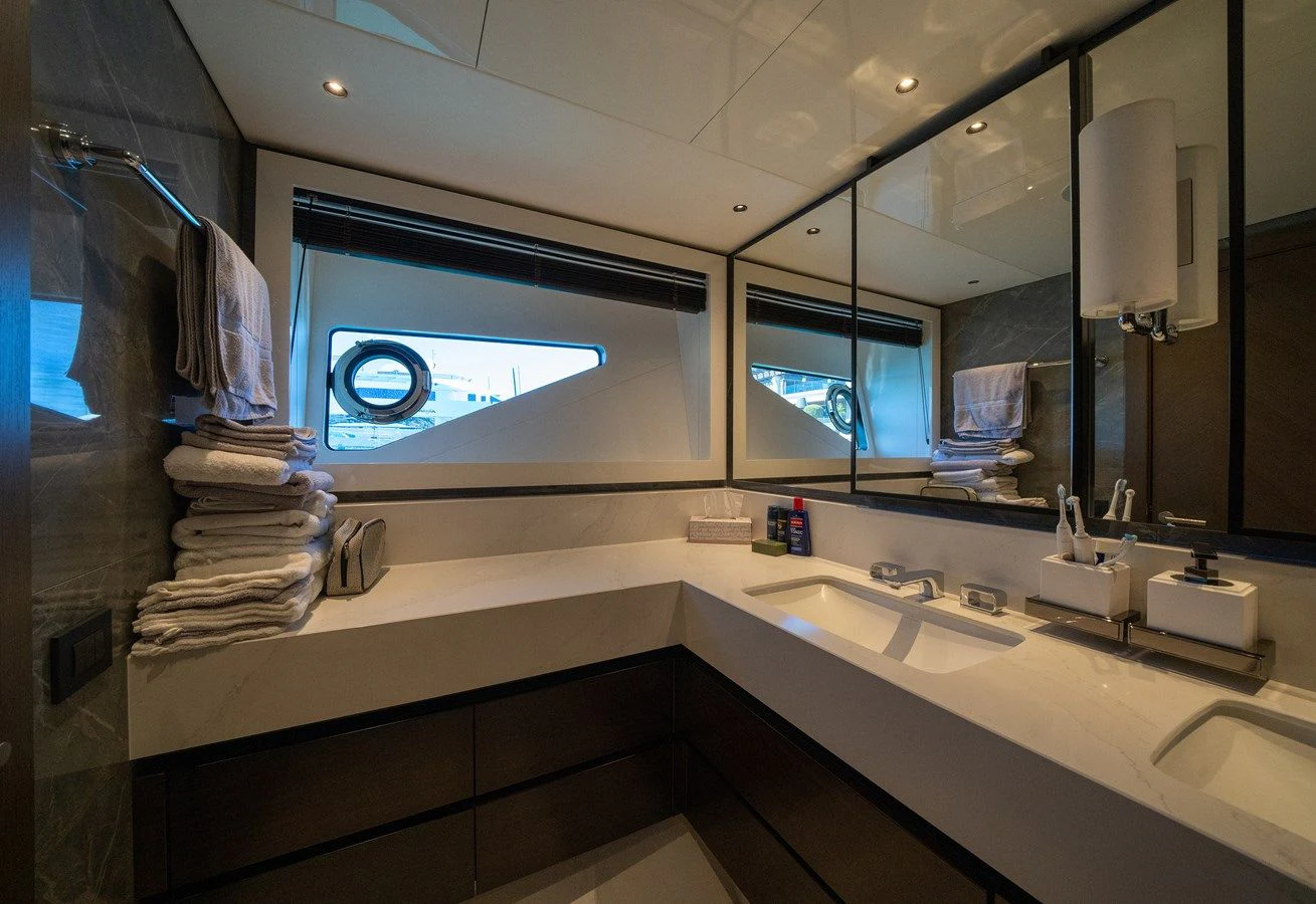 a bathroom with a large mirror aboard BANDAZUL Yacht for Sale