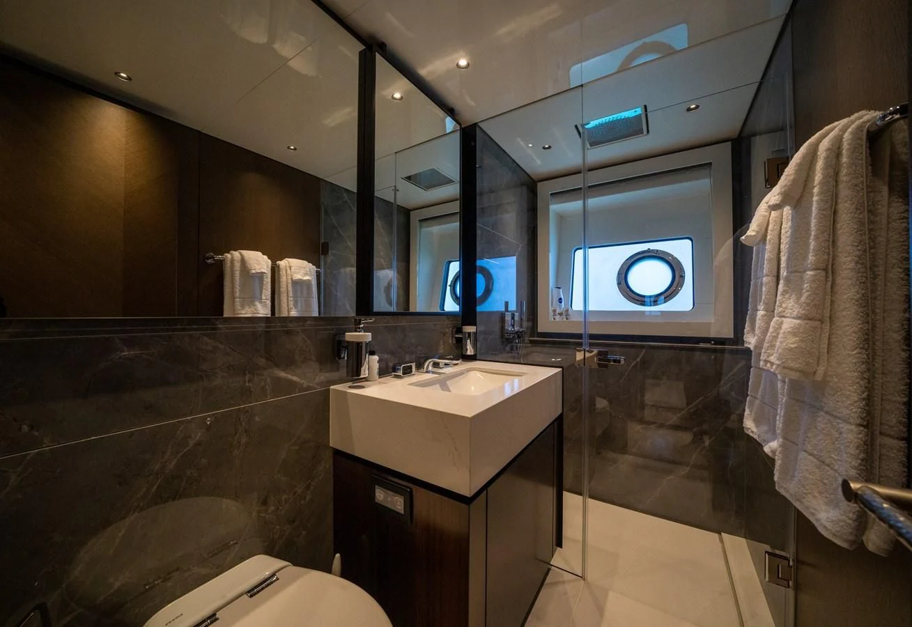 a bathroom with a large mirror aboard BANDAZUL Yacht for Sale