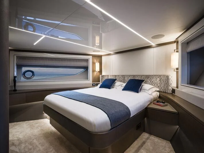 a room with a bed and a window aboard BANDAZUL Yacht for Sale