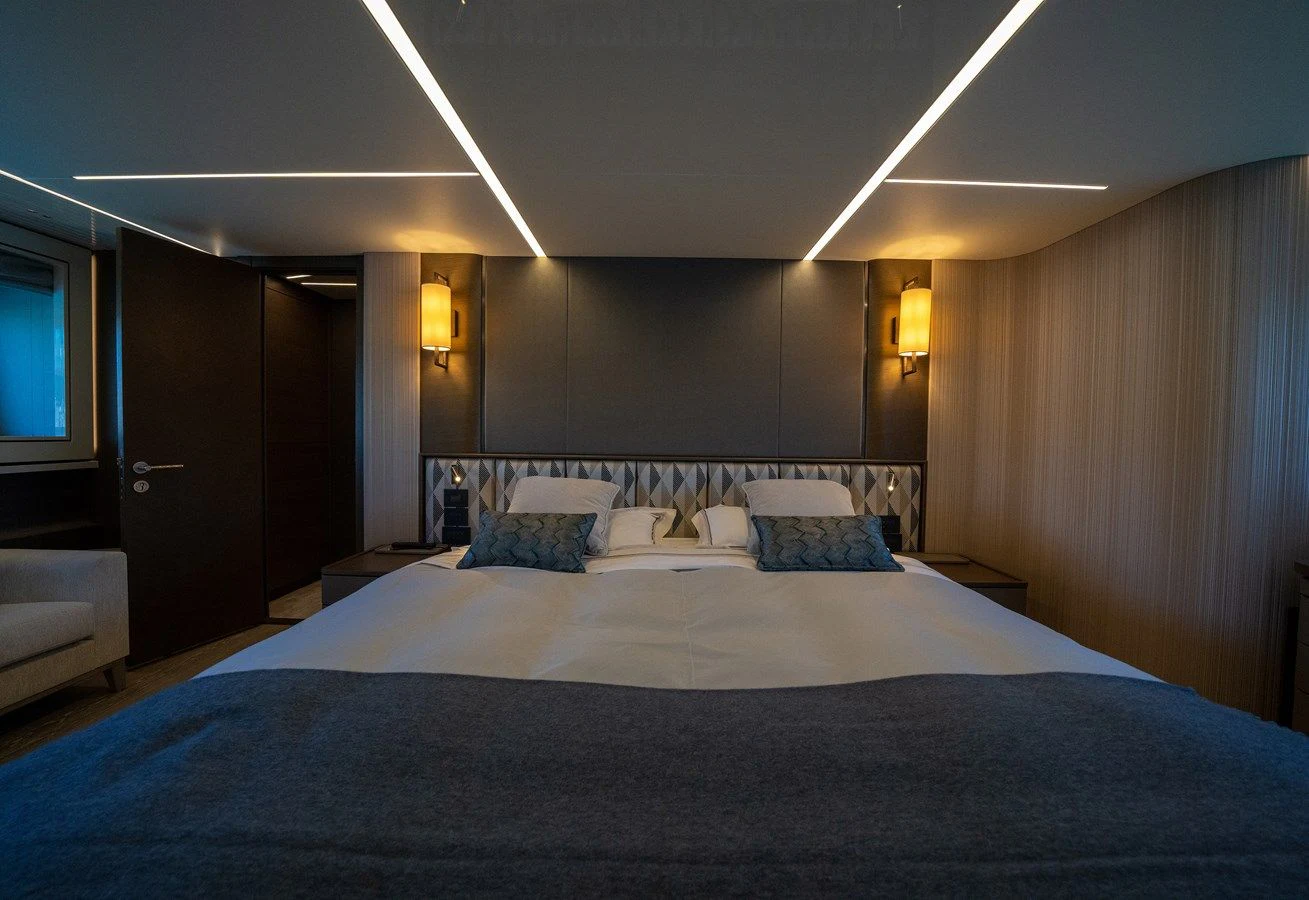 a large bed in a hotel room aboard BANDAZUL Yacht for Sale