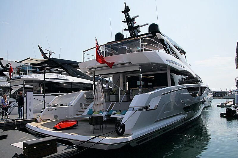 a large white boat with a red stripe on the front aboard BANDAZUL Yacht for Sale