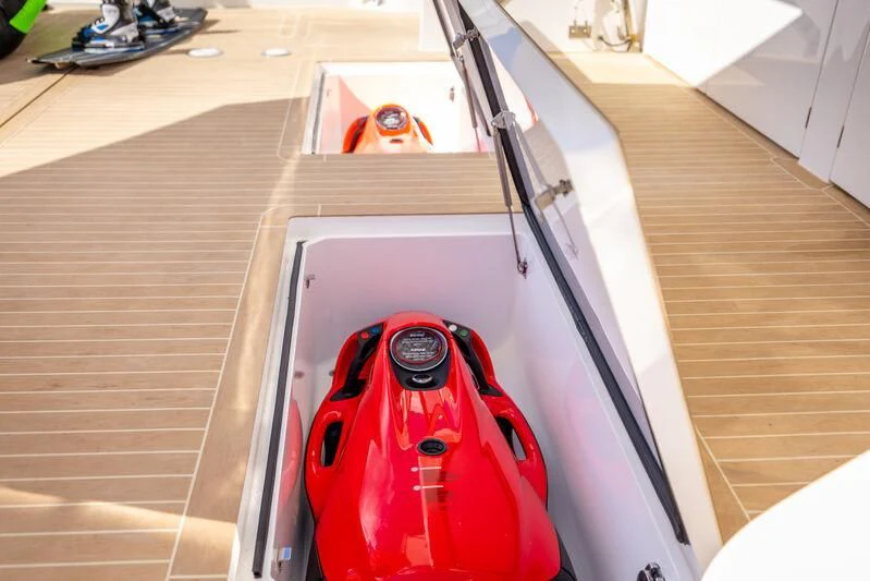 a red sports car parked in a garage aboard BANDAZUL Yacht for Sale