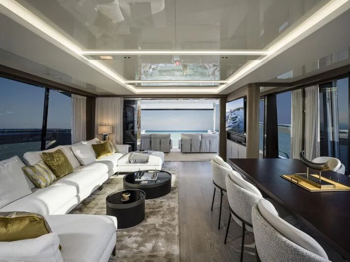 a living room with a large window aboard BANDAZUL Yacht for Sale