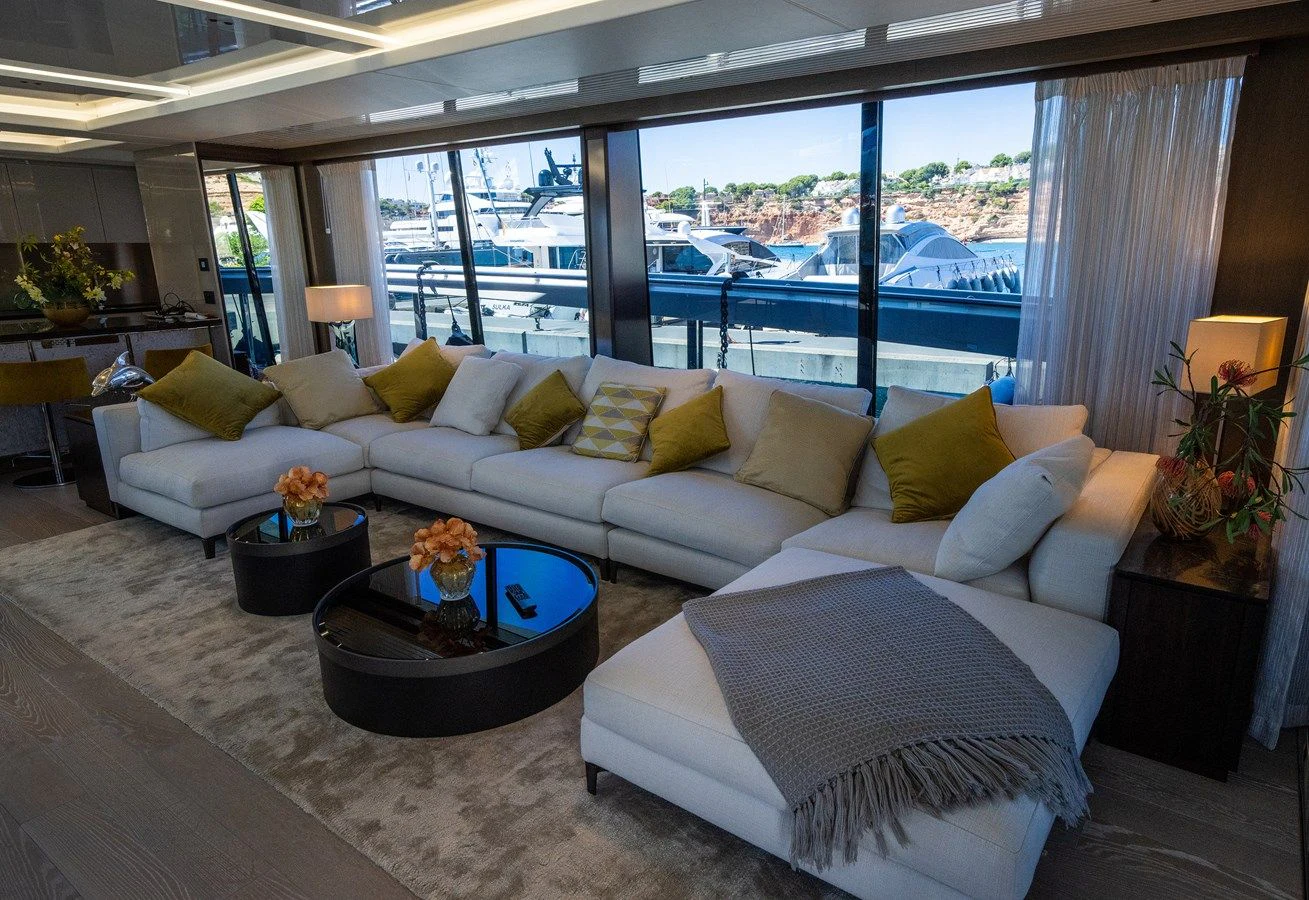a living room with a large window aboard BANDAZUL Yacht for Sale