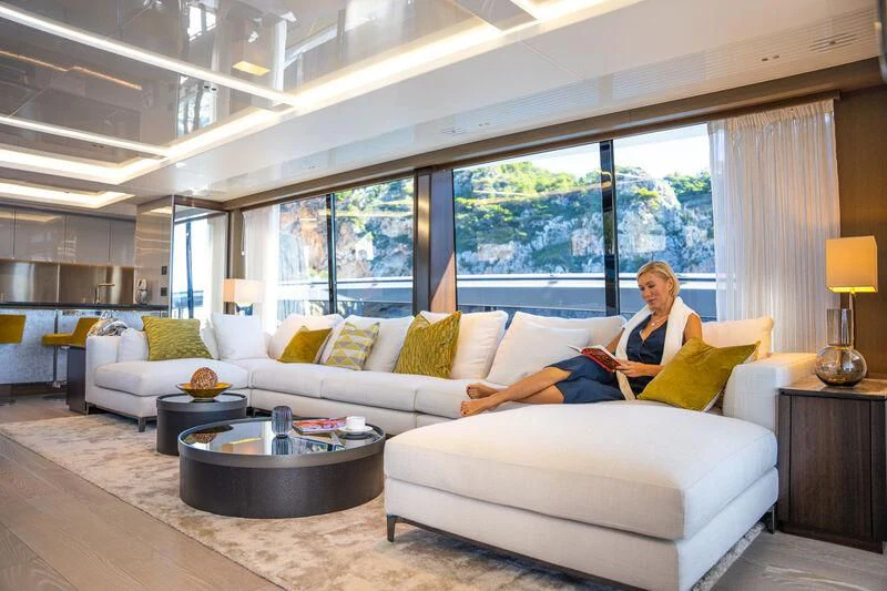 a person sitting on a couch aboard BANDAZUL Yacht for Sale