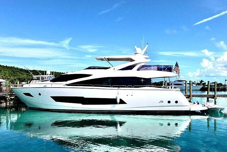 a white yacht in a harbor aboard SEA-ZAR Yacht for Sale