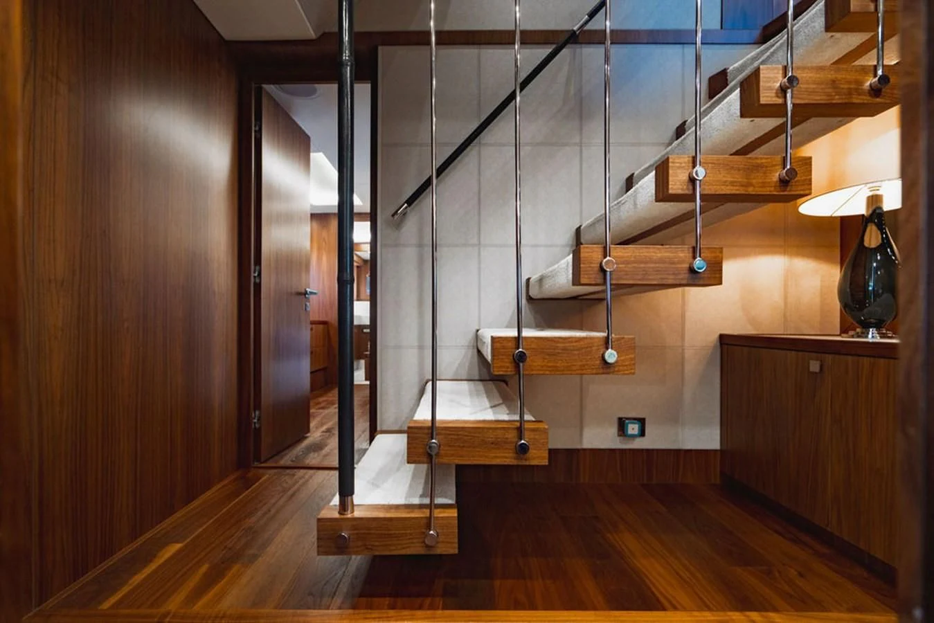 a room with wooden floors and wooden stairs aboard SEA-ZAR Yacht for Sale