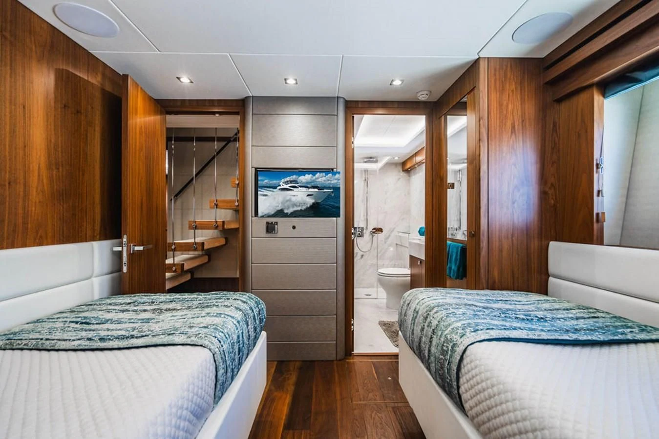 a bedroom with a bed and a closet aboard SEA-ZAR Yacht for Sale