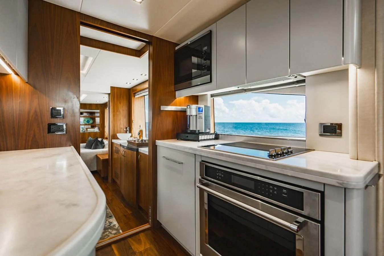 a kitchen with a large window aboard SEA-ZAR Yacht for Sale