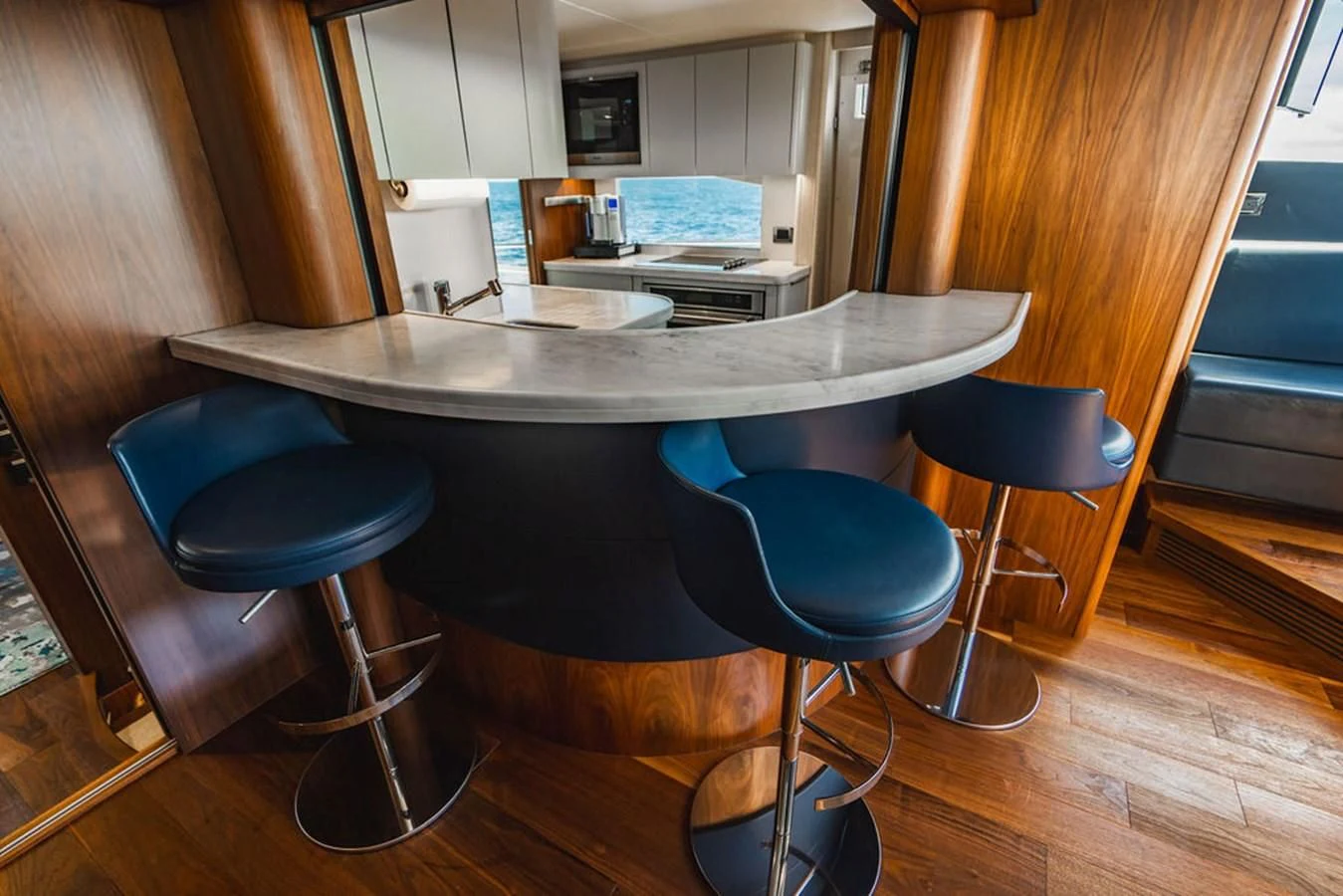 a table with stools and stools aboard SEA-ZAR Yacht for Sale