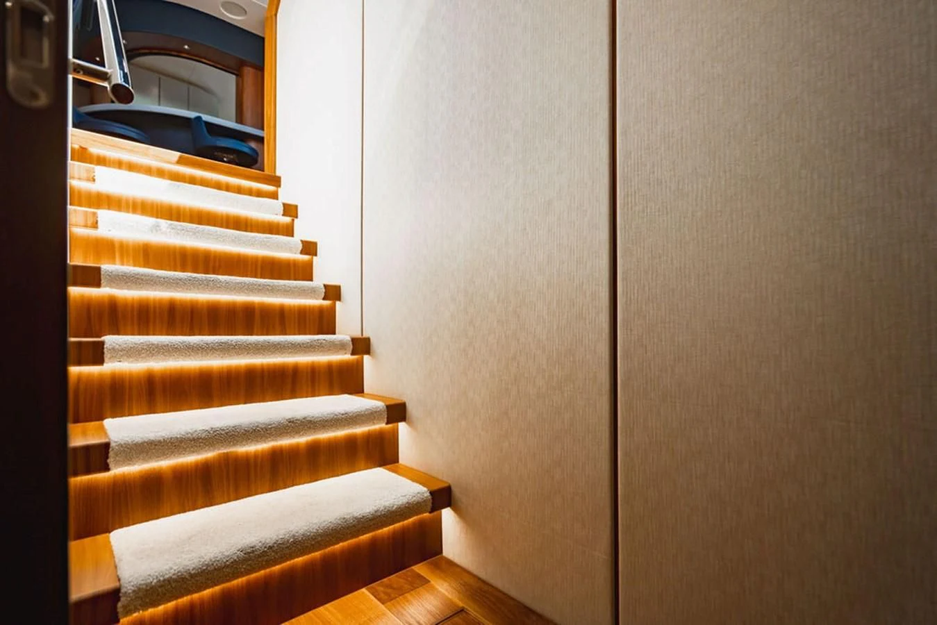 a set of stairs leading to a blue car aboard SEA-ZAR Yacht for Sale