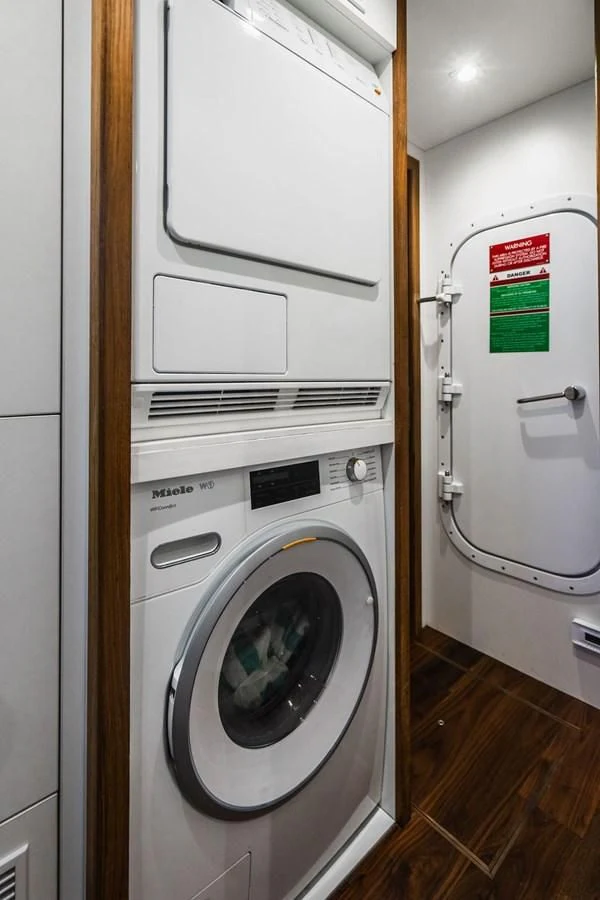a washer and dryer in a room aboard SEA-ZAR Yacht for Sale