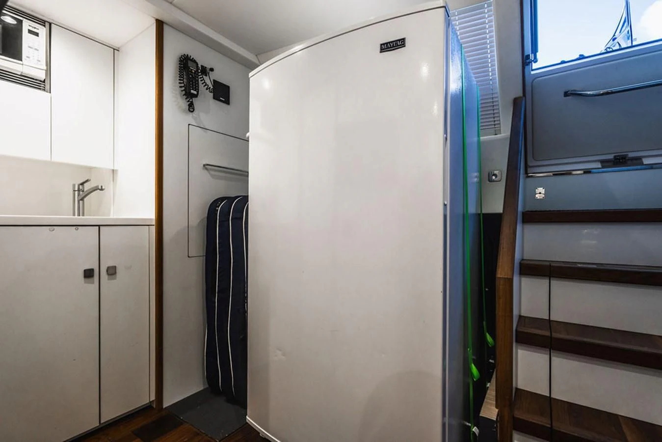 a room with a refrigerator and a microwave aboard SEA-ZAR Yacht for Sale