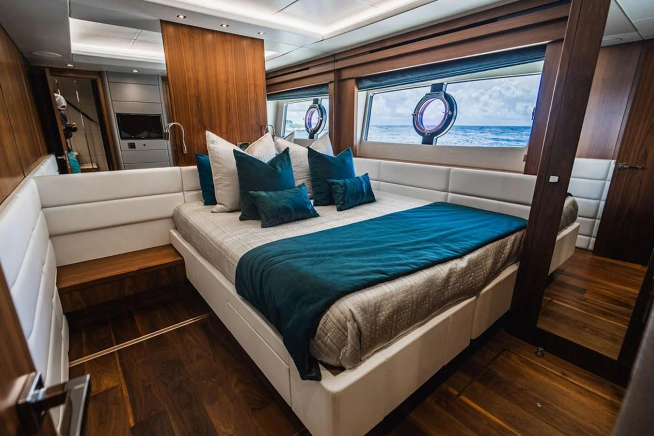 a room with a bed and a window aboard SEA-ZAR Yacht for Sale