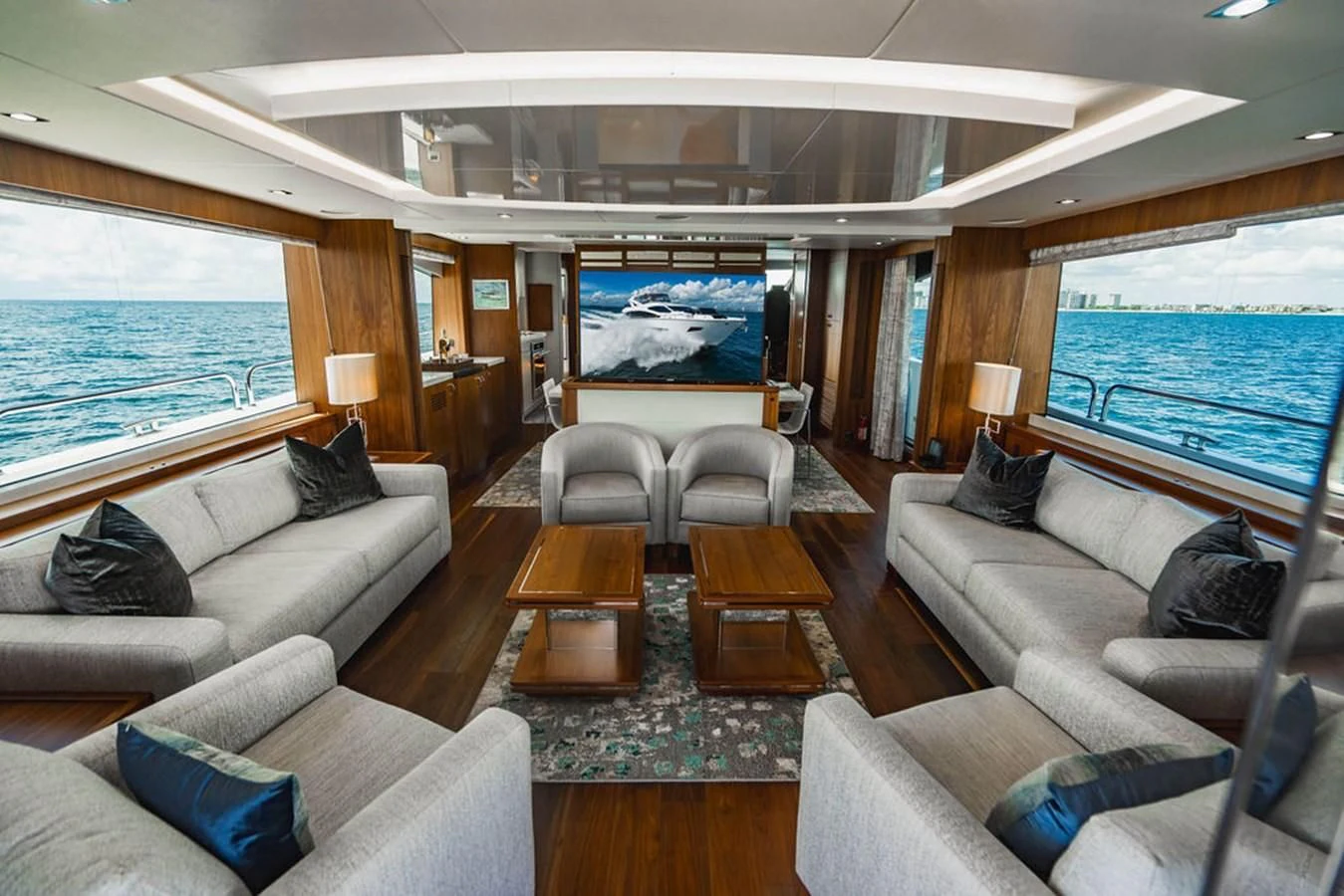 a living room with a large screen aboard SEA-ZAR Yacht for Sale