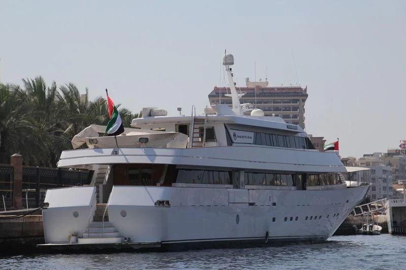 a large white boat on the water aboard AL FAHEDI Yacht for Sale
