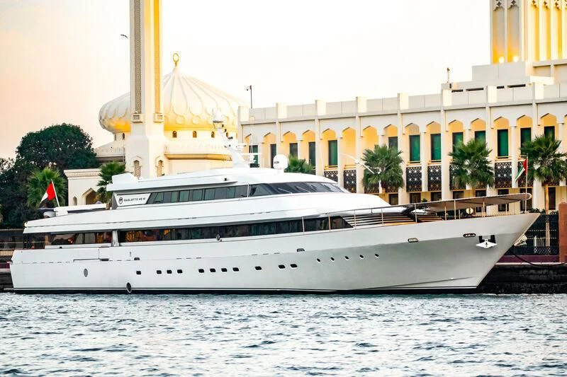 a large white boat in the water aboard AL FAHEDI Yacht for Sale