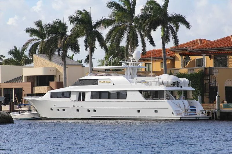 a large white boat in a tropical area aboard DOUBLE EAGLE Yacht for Sale