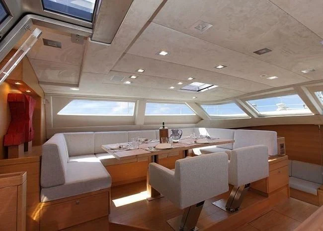 a room with a table and chairs aboard BLACK LION Yacht for Sale