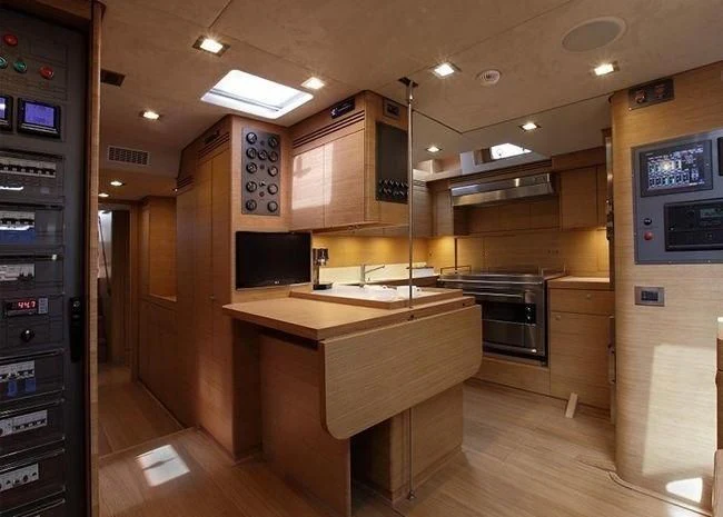 a kitchen with a counter and cabinets aboard BLACK LION Yacht for Sale