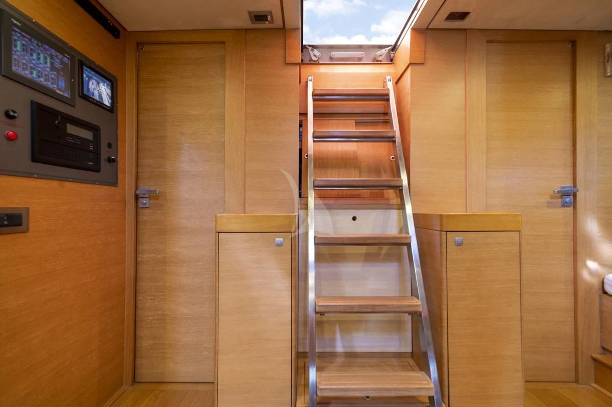 a wooden staircase in a room aboard BLACK LION Yacht for Sale