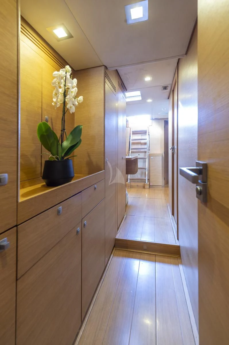 a wood cabinet in a room aboard BLACK LION Yacht for Sale