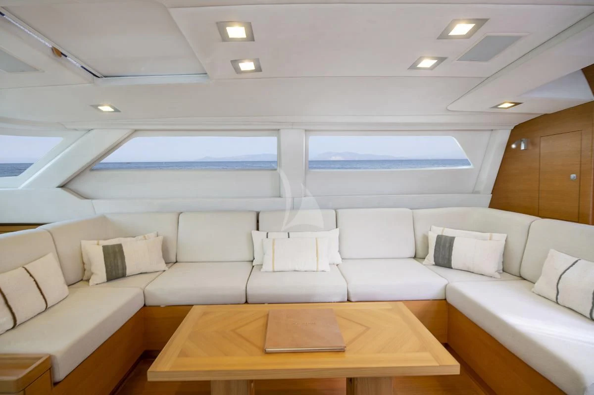 a room with couches and a table aboard BLACK LION Yacht for Sale