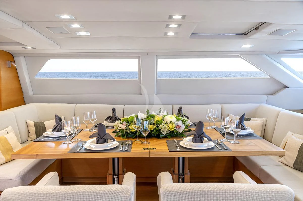 a table with plates and glasses aboard BLACK LION Yacht for Sale