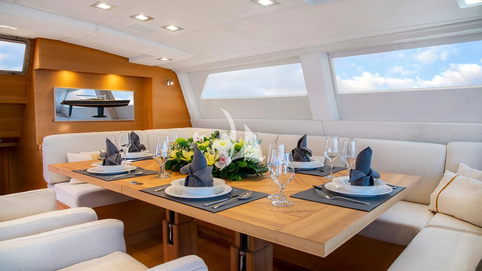 a table with plates and glasses on it aboard BLACK LION Yacht for Sale
