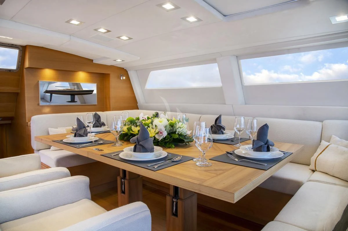 a conference room with a table and chairs aboard BLACK LION Yacht for Sale
