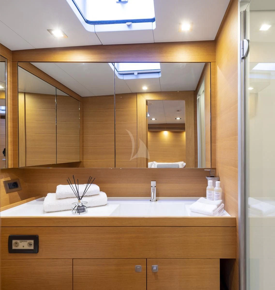 a bathroom with a large mirror aboard BLACK LION Yacht for Sale