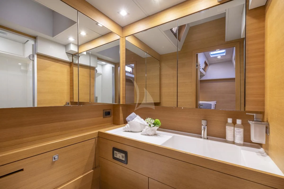 a bathroom with a large mirror aboard BLACK LION Yacht for Sale