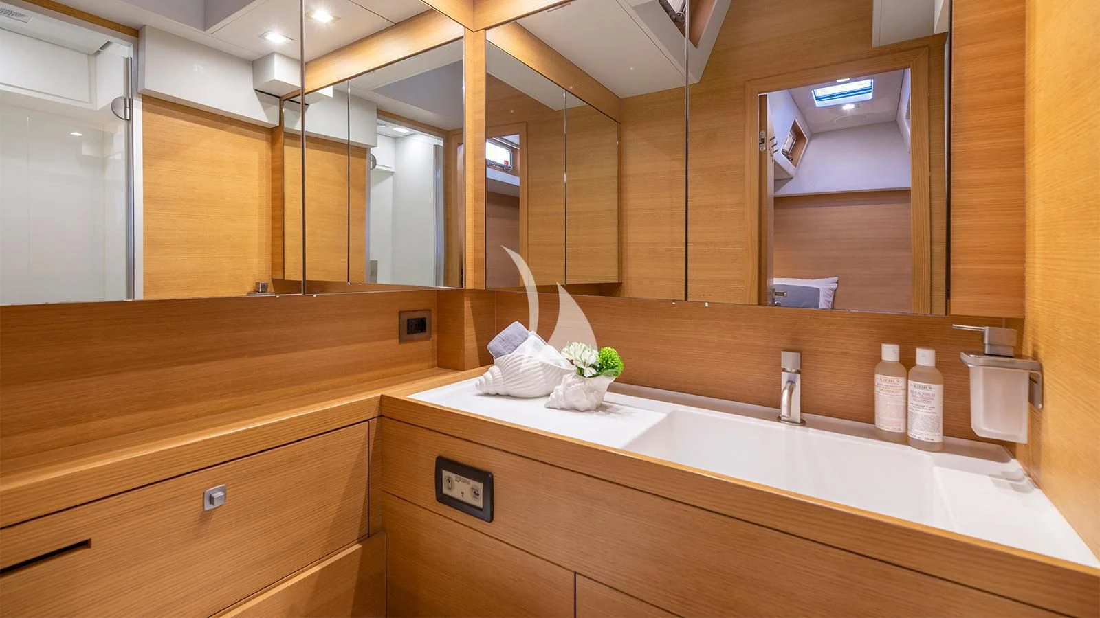 a bathroom with a large mirror aboard BLACK LION Yacht for Sale