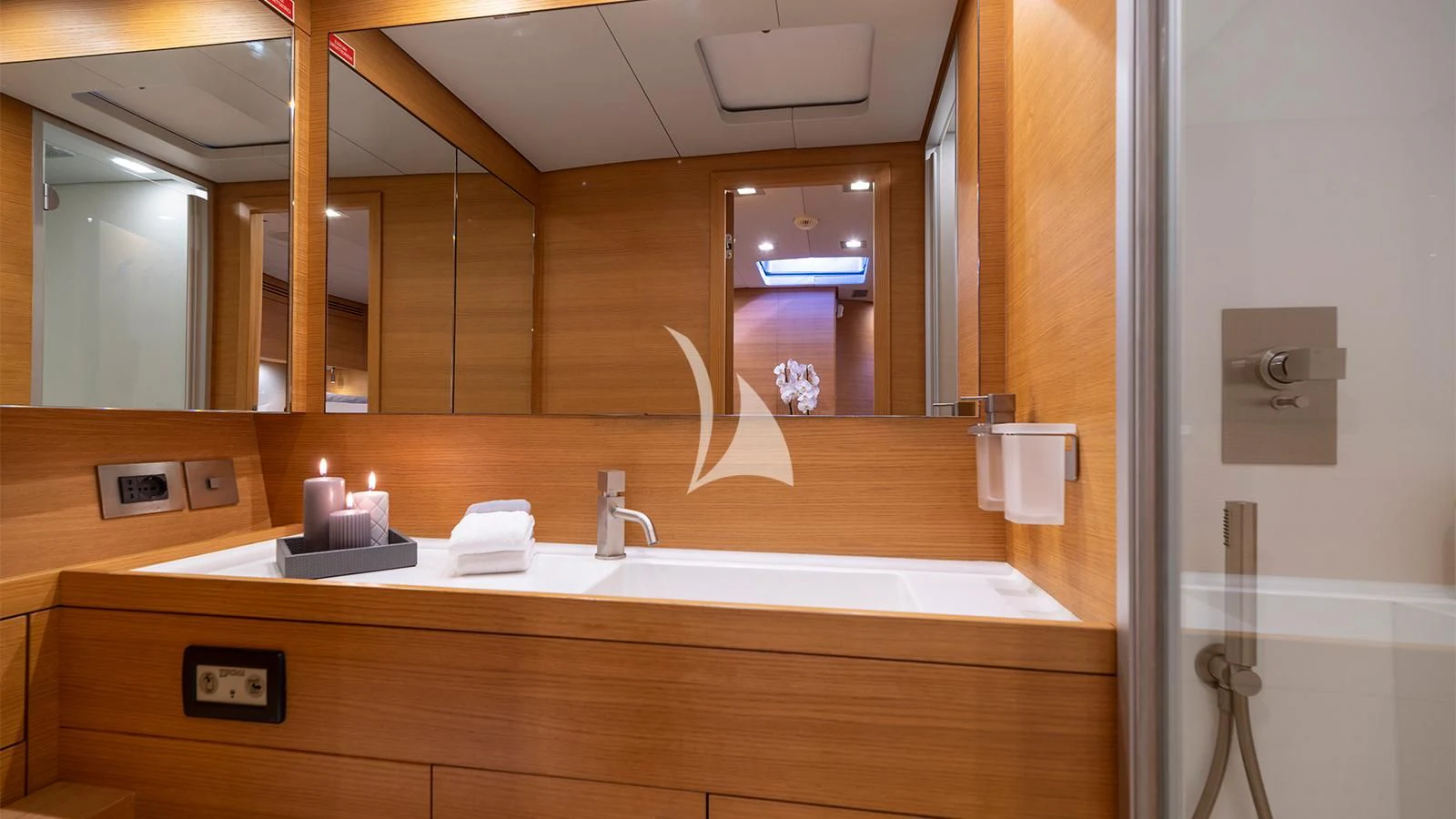 a bathroom with a large mirror aboard BLACK LION Yacht for Sale