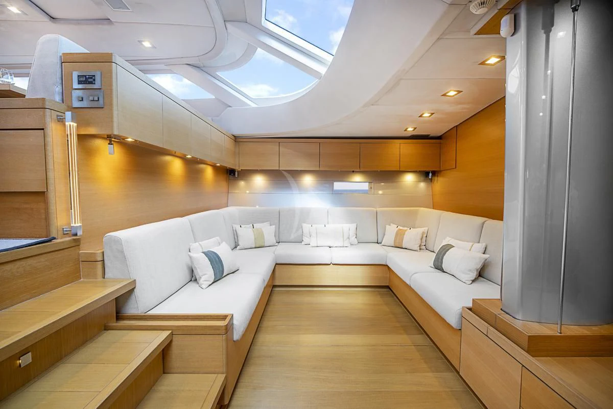 a room with a bed and a couch aboard BLACK LION Yacht for Sale