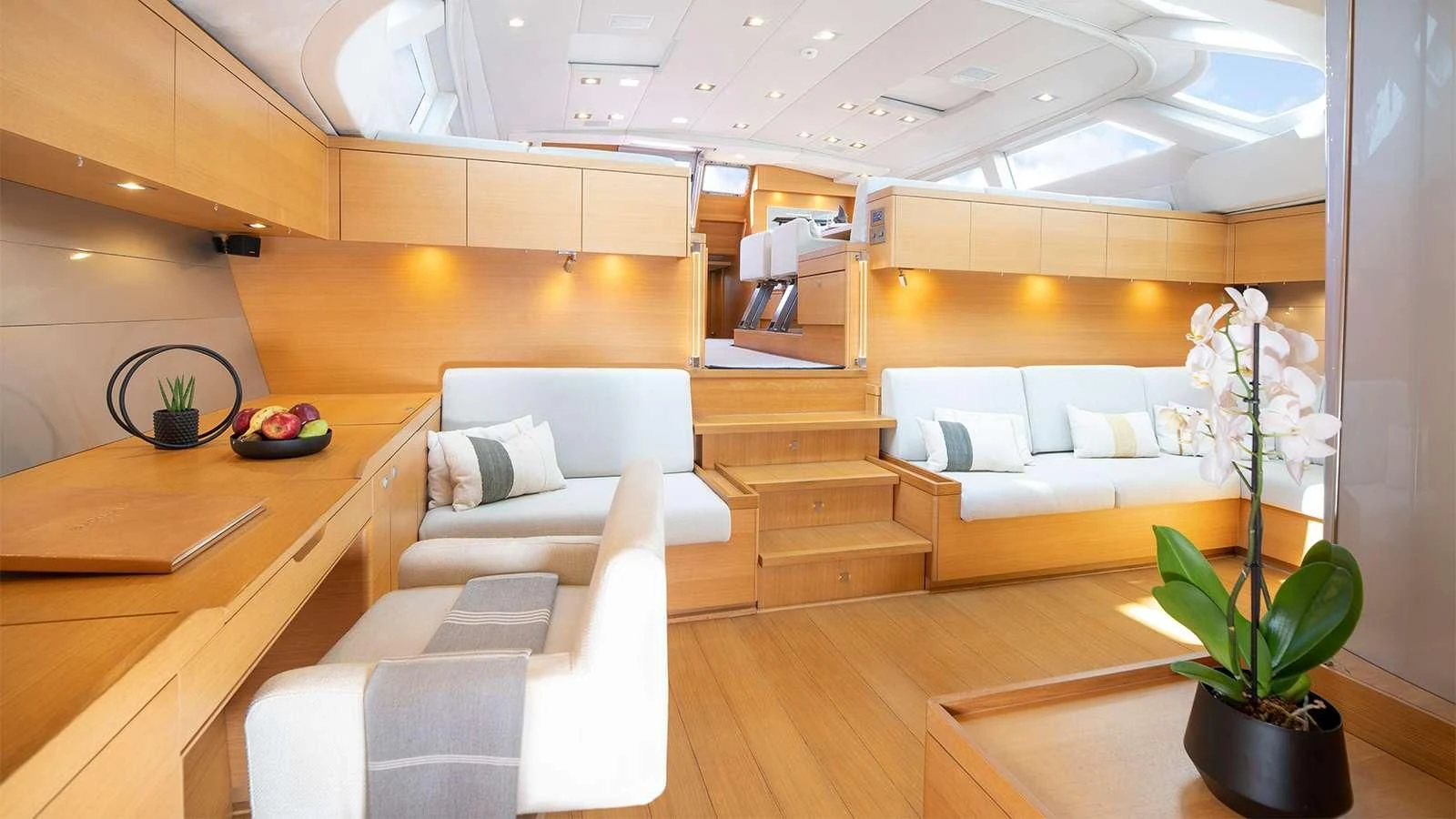 a room with a couch and a table and a plant aboard BLACK LION Yacht for Sale