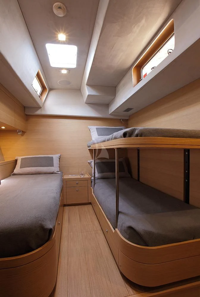 a room with a bed and a desk aboard BLACK LION Yacht for Sale