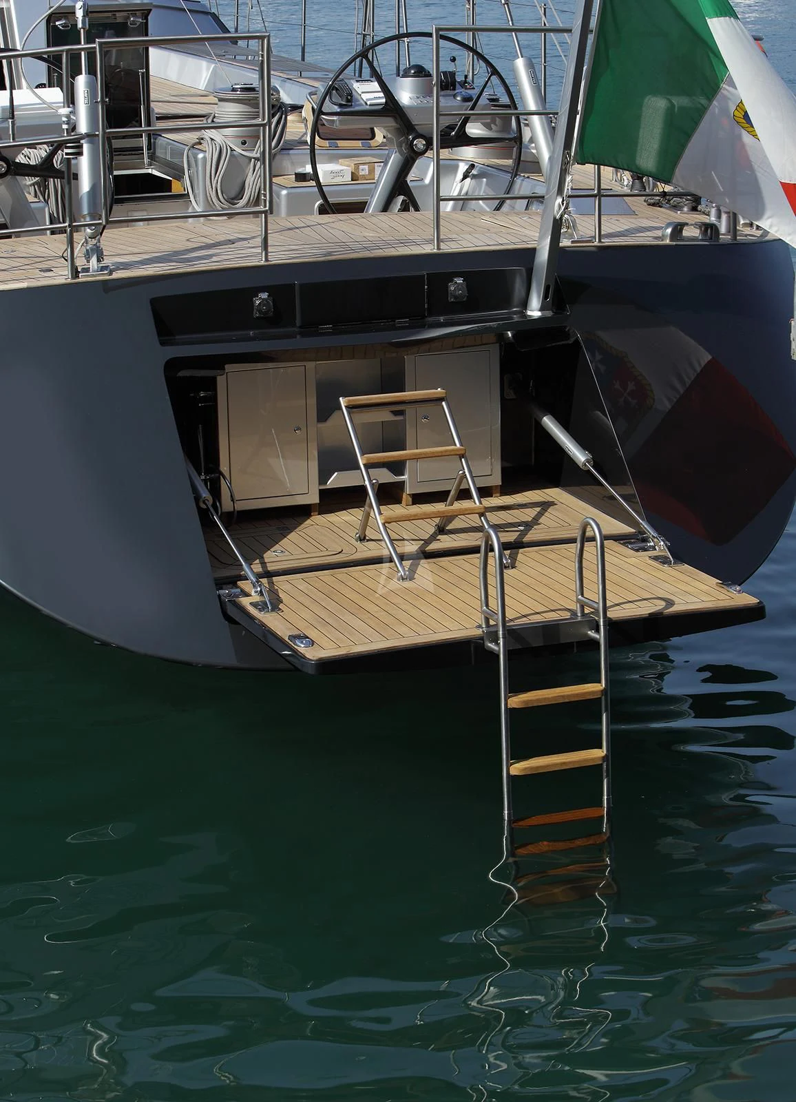 a boat with a deck and chairs on the deck aboard BLACK LION Yacht for Sale