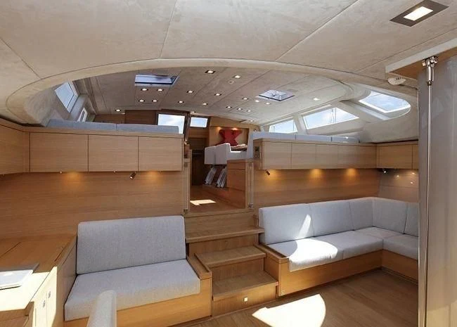 a room with couches and a table aboard BLACK LION Yacht for Sale