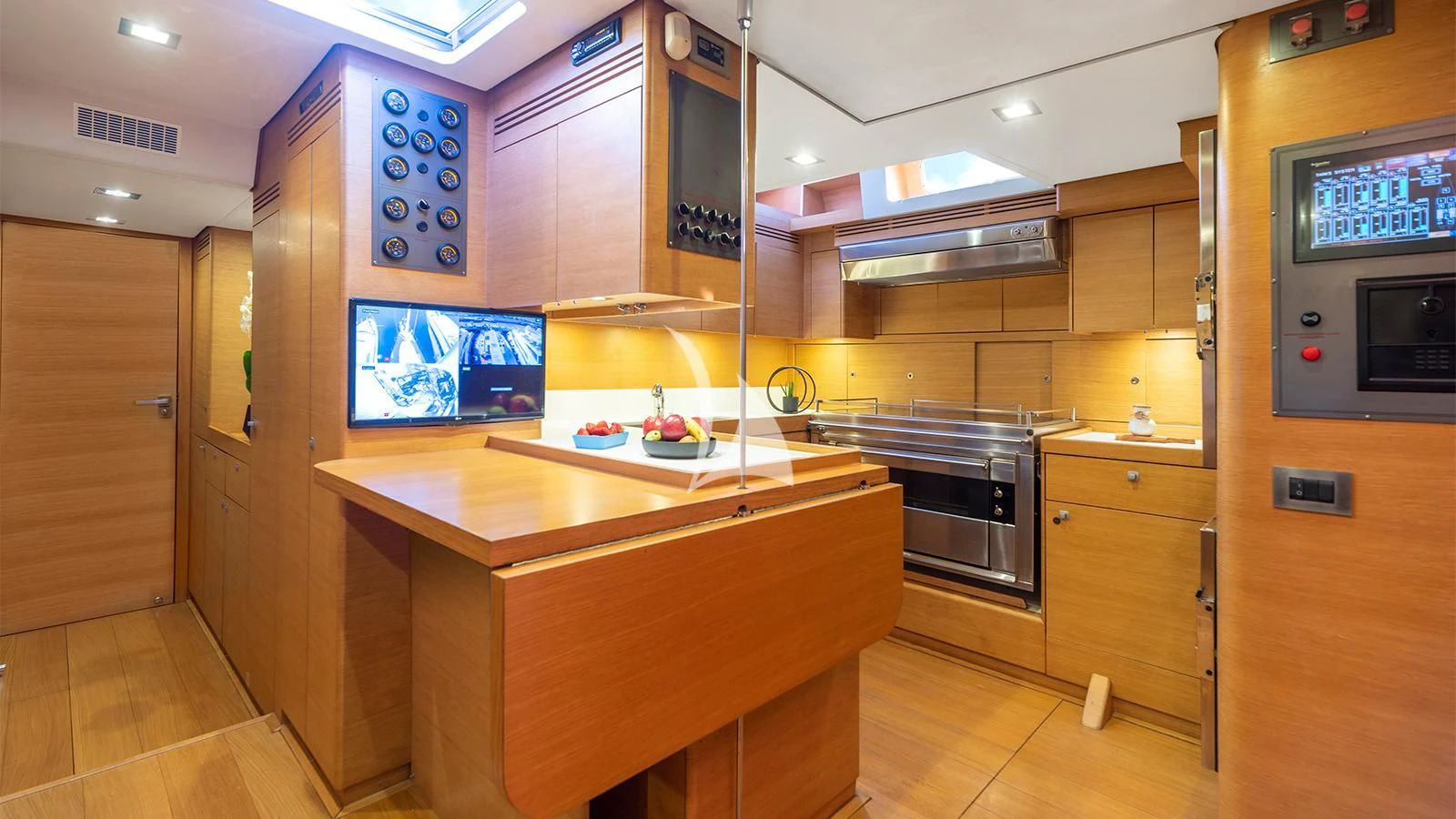a kitchen with wooden cabinets aboard BLACK LION Yacht for Sale