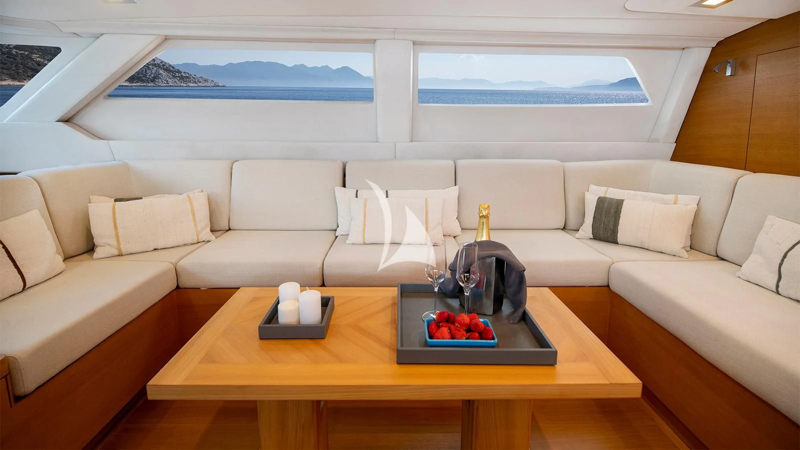 a living room with a couch and a table aboard BLACK LION Yacht for Sale