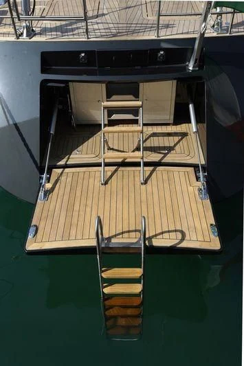 a table with chairs on it aboard BLACK LION Yacht for Sale